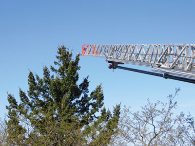 (1) Using treetops for aerial target practice is a safe drill that will not cause any property damage. The objective is to get the tip of the aerial to just touch the branches of the trees.