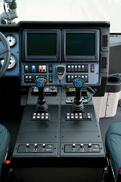 (2) To simplify the cab, firefighting controls in the Striker are located to the right of the driver (note the steering wheel at the far left of the photo) and vehicle controls to the left.