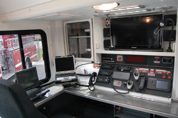 (3) The command and communications center is located behind the crew cab on FDNY's hazmat vehicle.