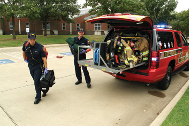 Firefighter Broox Nevil, left, and Lieutenant Wilson Spain put one of Plano Fire-Rescue's new rescue squad through its paces.