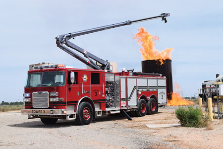 1 The Malaga (NM) Volunteer Fire Department in Eddy County, New Mexico, went to Pierce Manufacturing for its new pumper, a Pierce Arrow XT with a 50-foot Snozzle High-Reach Extendable Turret (HRET). (Photo courtesy of Pierce Manufacturing.) 2 The Pierce Snozzle pumper built for the Malaga (NM) Volunteer Fire Department has a Waterous CSU 1,500-gpm pump, a 1,250-gallon polypropylene water tank, a 200-gallon Class B foam cell, and a Husky 12 single-agent foam system. (Photo courtesy of Pierce Manufacturing