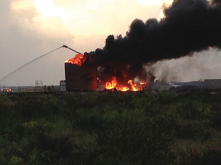 5 Lightning is usually the cause of tank fires at crude oil production facilities in the Malaga Volunteer Fire District’s coverage area in Eddy County, New Mexico, such as this fire being worked by Malaga’s Pierce Snozzle pumper. (Photo courtesy of Malaga Volunteer Fire District