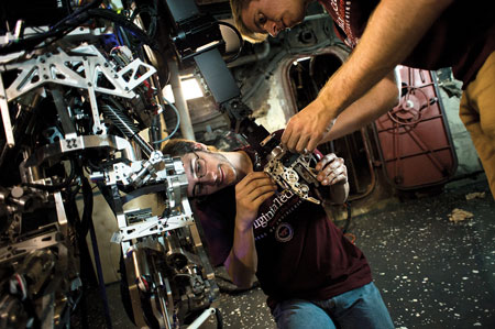 6 Virginia Tech researchers Jack Newton, left, and Mike Rouleau make adjustments to the firefighting robot. 