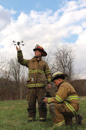 2 Valley Township (PA) Fire Department Lieutenant Matt Gum launches a Darley InstantEye drone while Chief Michael Kull operates the control unit. [Photo courtesy of the Valley Township (PA) Fire Department.]