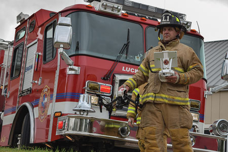 3 Joshua (TX) Fire Department firefighters have used the DJI Inspire drone to identify flood victims, fly rescue lines in swift water rescues, and identify thermal flows in structure fires. Here a Joshua lieutenant is getting ready to launch an Inspire. [Photo courtesy of the Joshua (TX) Fire Department.] 