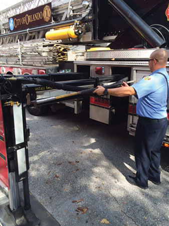 10 The six-foot hook on the Stuphen 110-foot tower ladder reaches to the inside of the stabilizing jack. A foot or so would have to be estimated after measuring with the hook for outrigger clearance. <em>(Photo by J.J. Cassetta.)</em>