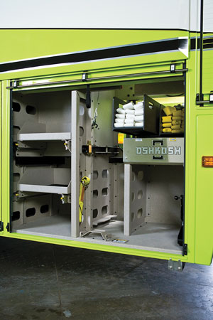 4 This Oshkosh-built ARFF truck has crosslays on sliding trays that are covered by roll-up doors. (Photo courtesy of Oshkosh.) 