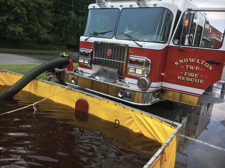 This dump site engine is positioned to afford water shuttle apparatus maximum maneuverability while offloading. This places the dump site engine in a position where the front intake is the best option for establishing the initial prime. Should flow demand increase, a Twin Tube Setup can be established.