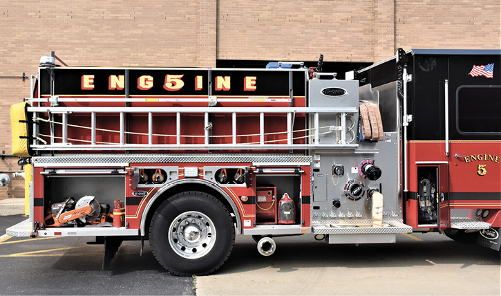 Officer-side compartments containing a portable generator, a fan, spare self-contained breathing apparatus (SCBA) cylinders, and saws. 