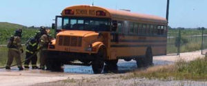 Firefighters and school bus