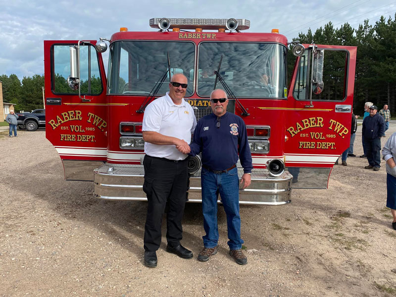 Fire Chief Todd Hendy of Charter Township of Lansing Fire Department, left, and Fire Chief Bruce Johnson of Raber Township Volunteer Fire Department. (Source: Raber Township VFD Facebook page)