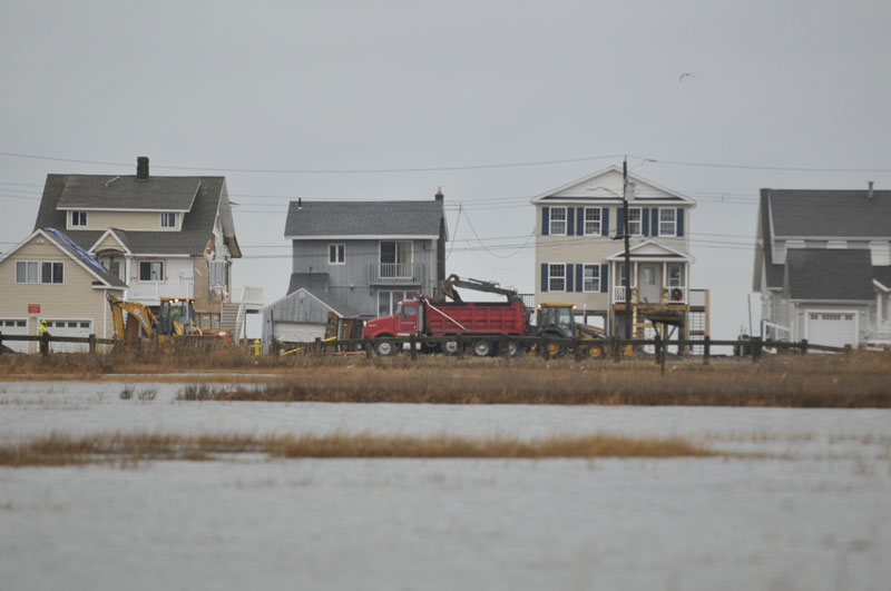 Some localized coastal flooding in East Haven. Construction continues on Caroline Road as residents recover from Sandy. (John Woike, Hartford Courant)