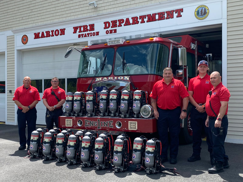 Marion firefighters stand next to the newly-received self-contained breathing apparatus. (L-R) FF/Paramedic Chester Moroz, Lt. Lyle McKay, Captain Brooks Wilson, FF/EMT Jacob Ouellette and Fire Inspector Joseph Tripp. (Source: Marion Fire / EMS Facebook page)