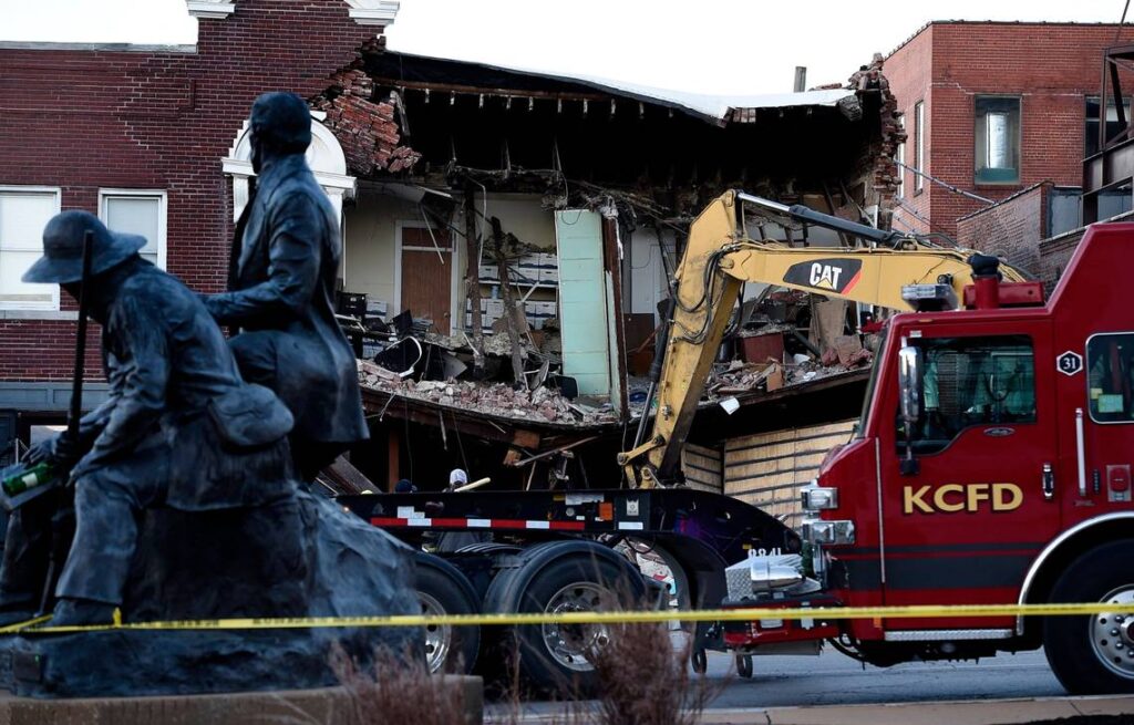 Three people were killed on Dec. 15, 2021, when a fire truck collided with an SUV and struck a building on Broadway just north of Westport Road. Emergency crews were on the scene Thursday morning clearing debris and hunting for possible victims. (Rich Sugg/rsugg@kcstar.com )