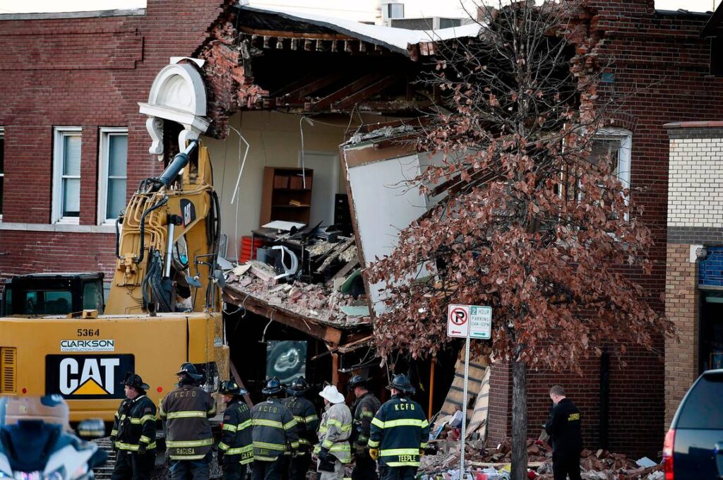 Kansas City firefighters were on the scene at 4048 Broadway Blvd., in Westport after a firetruck collided with a car killing two people and causing a partial building collapse. Rescue crews also found found the body of a pedestrian in the rubble. The wreck happened about 10:30 p.m. Wednesday, Dec. 15, 2021, in Kansas City as the firetruck was traveling north on Broadway. (Rich Sugg/rsugg@kcstar.com)