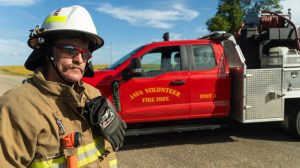 Java Fire District Chief Scott Zambro stands near the District's newest brush truck, which replaced a 1974 International Harvester that was beyond its useful life and was no longer dependable. (Source: RD.USDA.GOV)